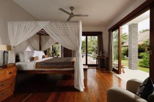 Katil atau katil-katil dalam bilik di Villa Uma Nina by Nakula