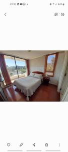 a bedroom with two beds and a window at Viña Park 2 in Viña del Mar