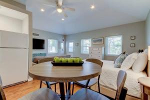 a living room with a table and a couch at Beautiful Studio in Downtown Dunedin! in Dunedin