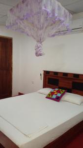 Letto o letti in una camera di Pidurangala View Home Stay