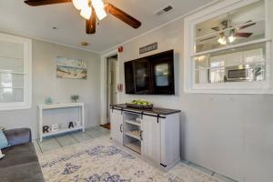 a kitchen with a counter and a ceiling fan at Light & Bright! Quaint Downtown Dunedin Bungalow! in Dunedin +10 photos