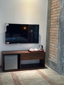 a flat screen tv sitting on top of a table at Ami Mirissa in Mirissa