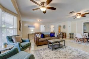 a living room with couches and a ceiling fan at Relaxing! Spacious 2 bedroom- close to everything! in Clearwater