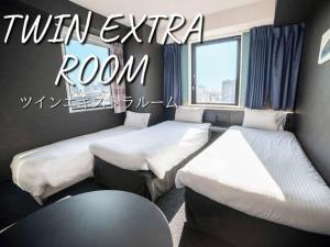 Postel nebo postele na pokoji v ubytování Henn na Hotel Tokyo Asakusabashi