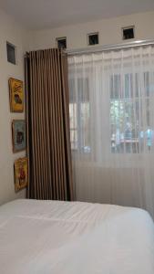 Ein Bett oder Betten in einem Zimmer der Unterkunft The Bloomy House