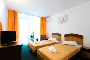 Voodi või voodid majutusasutuse Hotel Siret Saturn toas