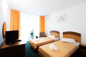 Voodi või voodid majutusasutuse Hotel Siret Saturn toas