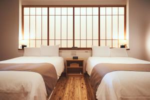 Giường trong phòng chung tại Sui Suwako