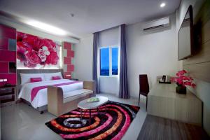 Voodi või voodid majutusasutuse favehotel Langko Mataram - Lombok toas