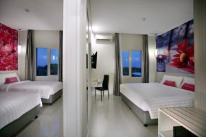 Voodi või voodid majutusasutuse favehotel Langko Mataram - Lombok toas