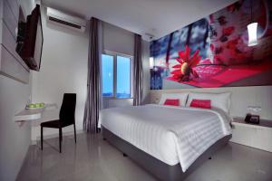 Voodi või voodid majutusasutuse favehotel Langko Mataram - Lombok toas