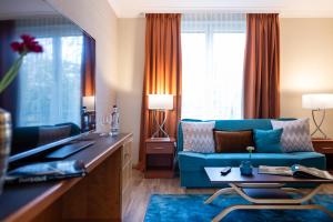 TV a/nebo společenská místnost v ubytování Parkhotel Görlitz