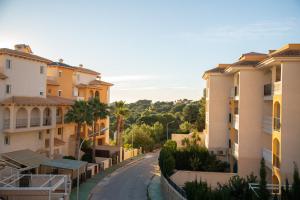 a street in a city with buildings at Open view Pinetree penthouse in Dehesa de Campoamor