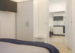 Ένα ή περισσότερα κρεβάτια σε δωμάτιο στο Appartamento con 2 camere e 2 bagni in centro con parcheggio
