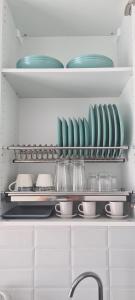 a kitchen with plates and dishes on shelves at Chinyero Path in Tamaimo +11 photos