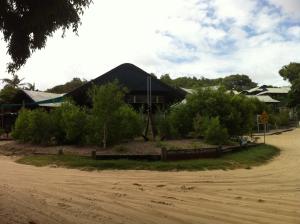 a house on the side of a dirt road at Fraser Island Retreat in Fraser Island