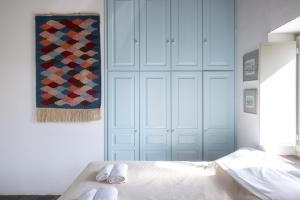 a bedroom with a bed with two towels on it at Armira seaside house in Antiparos