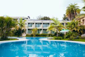a view of the resort from the pool at Gorillas Lake Kivu Hotel in Gisenyi