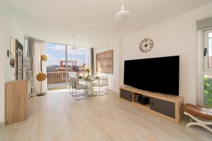 a living room with a large flat screen tv at Cristal in Finestrat