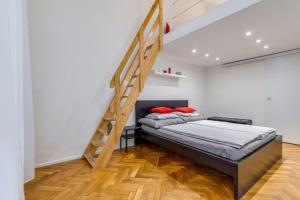 A bed or beds in a room at Little Cola apartment in Dohány street with AC