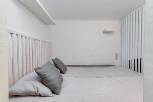 A bed or beds in a room at Little Cola apartment in Dohány street with AC