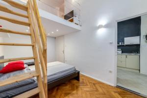 A bed or beds in a room at Little Cola apartment in Dohány street with AC