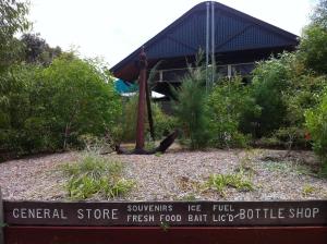 a sign in front of a fresh food foodeatettle shop at Fraser Island Retreat in Fraser Island