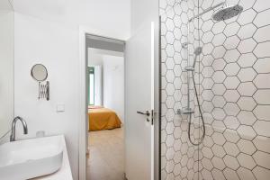 a bathroom with a shower and a sink at Calatrava - Darya Living in Madrid +155 photos
