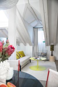 a living room with a couch and a table at Calatrava - Darya Living in Madrid