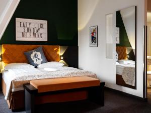 Łóżko lub łóżka w pokoju w obiekcie Hotel Villa Carlton - Adults Only