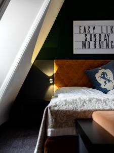 Łóżko lub łóżka w pokoju w obiekcie Hotel Villa Carlton - Adults Only