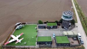 an aerial view of an airport with a plane at Lancaster in Boston