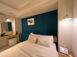 Postel nebo postele na pokoji v ubytování Hotel Yaja Hwajeong Station