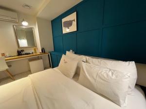 Postel nebo postele na pokoji v ubytování Hotel Yaja Hwajeong Station