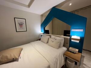 Postel nebo postele na pokoji v ubytování Hotel Yaja Hwajeong Station