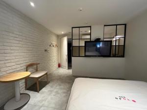 Postel nebo postele na pokoji v ubytování Hotel Yaja Hwajeong Station