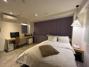 Postel nebo postele na pokoji v ubytování Hotel Yaja Hwajeong Station