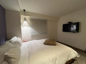 Postel nebo postele na pokoji v ubytování Hotel Yaja Hwajeong Station