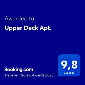 a blue screen with the words upgraded to upper desk app at Upper Deck Apt. in Nea Peramos