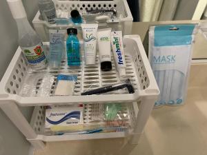 a drawer filled with toothbrushes and other bathroom items at Marine Surf in Honolulu