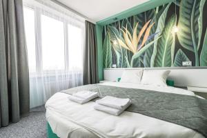 Postel nebo postele na pokoji v ubytování Art Hotel Palma
