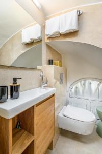 a bathroom with a sink and a toilet at Nina Luxury Apartment in Jerusalem