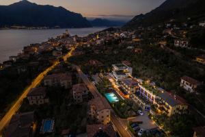 an aerial view of a city at night at Wellness Hotel Casa Barca (Adult Only) in Malcesine