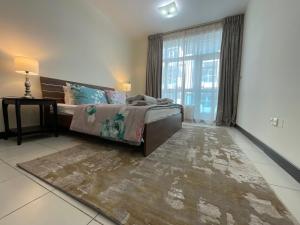 Fotografie z fotogalerie ubytování Pleasant 1BHK Condo with Pool, Gym, Hamam & more v Dubaji