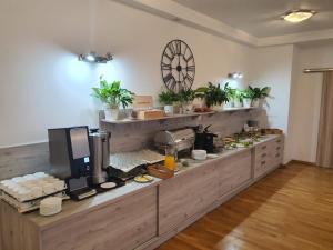 a kitchen with a counter with food on it at Polonia in Międzyzdroje