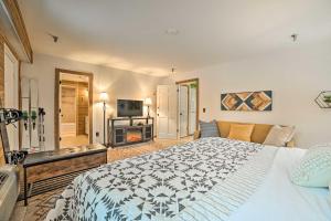 a large bedroom with a bed and a fireplace at Ski-InandSki-Out Boyne Mountain Resort Rental! in Boyne Falls