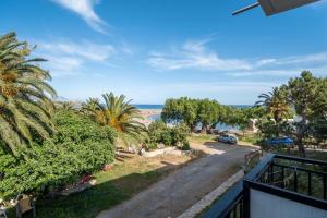 a view of the beach from the balcony of a house at Maria's Studios in Frangokastello