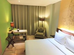 Ένα ή περισσότερα κρεβάτια σε δωμάτιο στο AONE Hotel