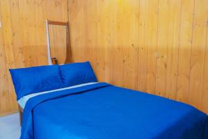 Postel nebo postele na pokoji v ubytování Blue Moon Residency