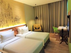 Ένα ή περισσότερα κρεβάτια σε δωμάτιο στο AONE Hotel
